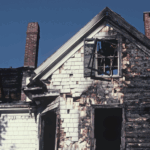 A home that has been charred and burned by a recent fire.